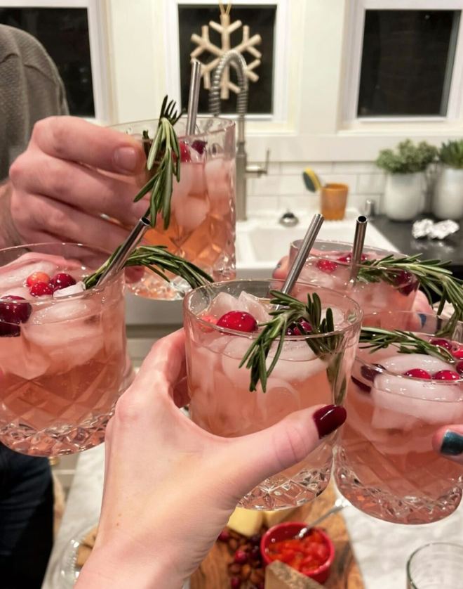 group of friends cheersing cocktail glasses